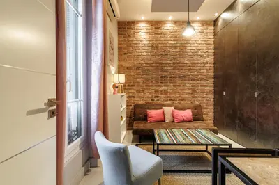 a bedroom with a white bed and a window at Charming 1 Bdr Downtown in Nice