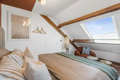 a bedroom with a bed and a window at Studio sous les toits, Nice Centre in Nice