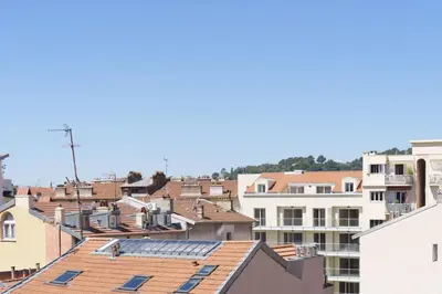 a view of a city with roofs and buildings at Studio sous les toits, Nice Centre in Nice