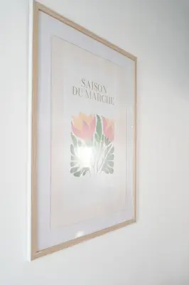 a framed picture of a flower on a wall at Le Riviera France in Nice