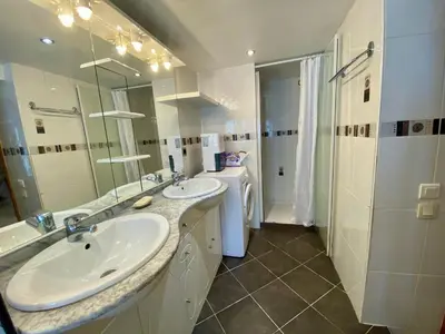 a bathroom with two sinks and a shower at T4 Nice Centre - Close to shops, Wi-Fi, AC in Nice