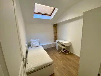 a small room with a bed and a desk at T4 Nice Centre - Close to shops, Wi-Fi, AC in Nice