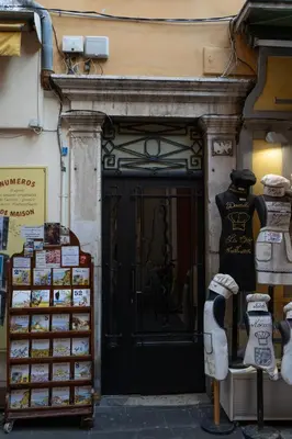 a store front with a black door with a lot of merchandise at La Casa Nissa in Nice