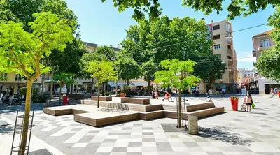 a park with benches and trees in a city at Studio Ciste avec terrasse à Cagnes-sur-Mer in Cagnes-sur-Mer