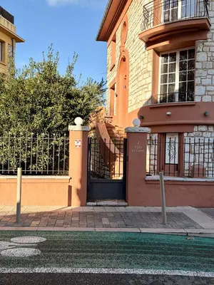 a building with a gate in front of it at Studio Ciste avec terrasse à Cagnes-sur-Mer in Cagnes-sur-Mer