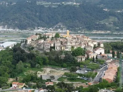 a small town on top of a hill with houses at Holiday Home Rocabel mit Blick auf das Wasser by Interhome in Gattières