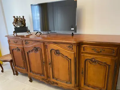a wooden dresser with a television on top of it at Cosy Nice Promenade des Anglais Beach Apartment 2 rooms in Nice