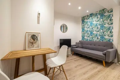 a living room with a couch and a table at Cozy Apartment a-c 1BR-2P - Nice in Nice