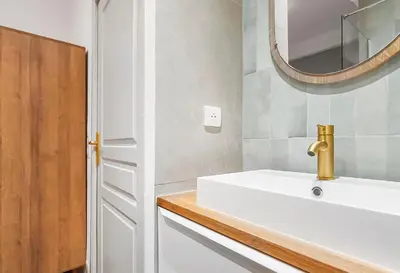 a bathroom with a white sink and a mirror at T2design, élégant & calme à Nice in Nice