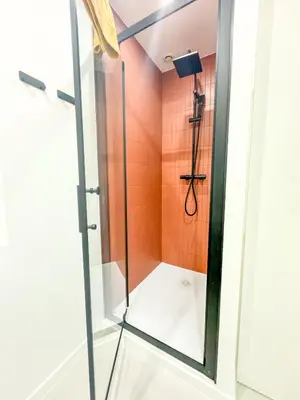 a shower in a bathroom with a glass door at Confortable & Élégant climatisé au Port de Nice in Nice