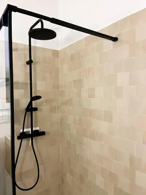a shower with a shower head in a bathroom at Nice Boheme in Nice