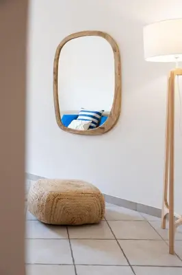 a white living room with a table and a couch at Appartement charmant & cosy au cœur du Vieux Nice in Nice