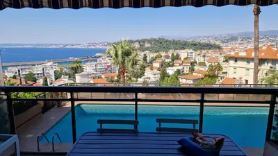 a view of a swimming pool from a balcony at Nice Mont Boron proche du Port in Nice