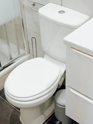 a bathroom with a white toilet and a sink at Elegant Apartment with Balcony, Central Nice in Nice