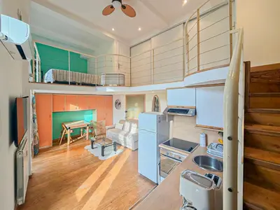 a kitchen and living room with a refrigerator and a table at Place Grimaldi - Wifi, AC, 3pers in Nice