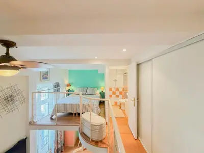 a living room with a table and a dining room at Place Grimaldi - Wifi, AC, 3pers in Nice