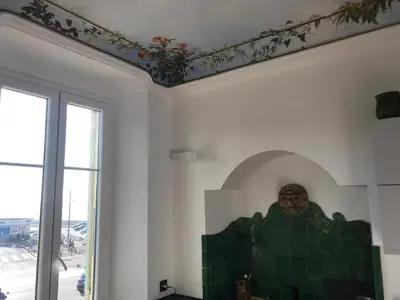 a dining room with a table and a large window at Appartement 3P Nice port Sea view in Nice