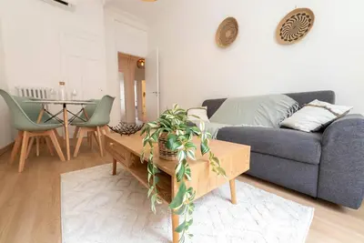 a living room with a couch and a table at Bright apartment Nice harbour in Nice