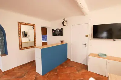 a room with a mirror and a tv on the wall at ROCHE-Rock in the heart of the Old Town in Villefranche-sur-Mer