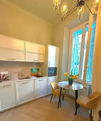 a kitchen with a sliding door in a room with a counter at Mediterranean Dream - Carré d'Or in Nice