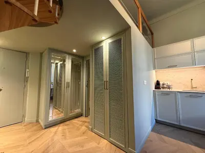 a kitchen with white cabinets and a sink and a microwave at Mediterranean Dream - Carré d'Or in Nice