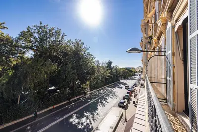 a street with cars parked on the side of a building at Perfect Location downtown - elegant apartment in Nice
