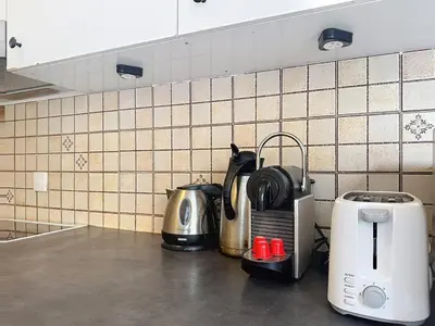 a kitchen counter with a toaster and a coffee maker at One bedroom apartment with terrace , Port de Nice , ideal location in Nice