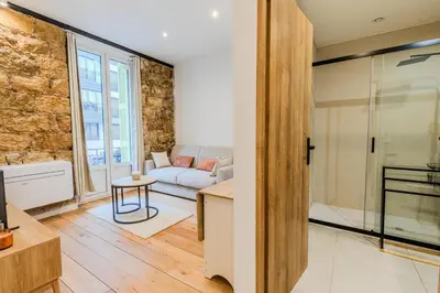 a living room with a couch and a table at Dolce Vita - Studio Centre Nice in Nice