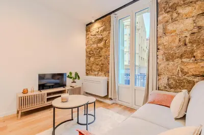a living room with a couch and a table at Dolce Vita - Studio Centre Nice in Nice