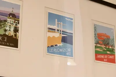a group of three posters on a wall at Quiétude - Studio calme avec vue jardin en hyper centre de Nice in Nice