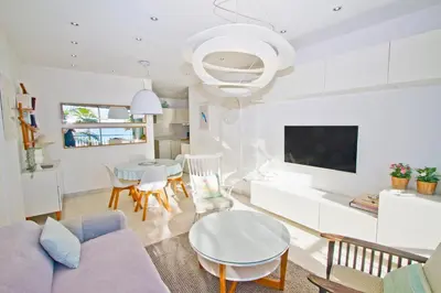 a living room with a couch and a table at Le Copacabana Riviera in Nice