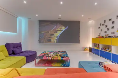 a living room with a couch and a painting on the wall at Villa Alba VI4498 by Riviera Holiday Homes in Nice
