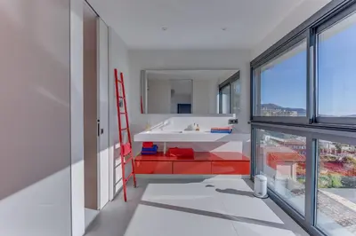 a bathroom with a white sink and a red ladder at Villa Alba VI4498 by Riviera Holiday Homes in Nice