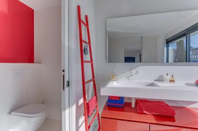 a bathroom with a red ladder next to a white sink at Villa Alba VI4498 by Riviera Holiday Homes in Nice