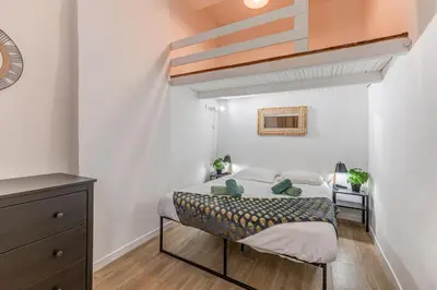 a small bedroom with a bed in a room at Vieille Ville - parking, 5 pers, AC, WIFI in Nice