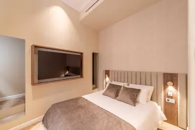 a bedroom with a bed and a flat screen tv at 2BDR 6P central A C apt - heart of Nice - Beach in Nice