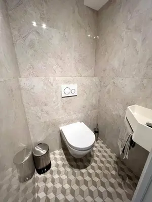 a bathroom with a toilet and a sink at La Vigie in Nice