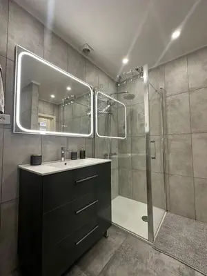 a bathroom with a shower and a sink and a mirror at Cozy Apartment in the heart of Nice in Nice