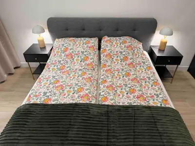 a bed with two nightstands and two tables with lamps at Nikaia Residence - 2BR Central Nice Close to Everything in Nice