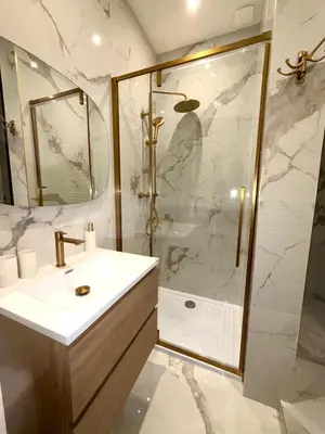 a bathroom with a shower and a white sink at BLUE SKY Apartment in Nice