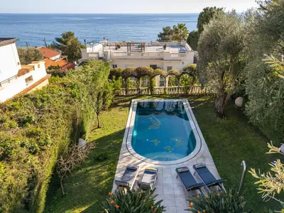an overhead view of a swimming pool with chairs and a house at Villa Belle Epoque, sea view, pool & hammam in Èze