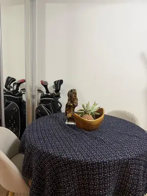 a dog sitting on a table with a bowl on it at Studio église russe in Nice