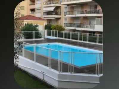 a large swimming pool on top of a building at Palais Des Domes Adagio Aparthotel in Nice
