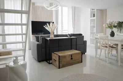 a living room with a couch and a table at Azur Carré d'or Duplex 6 pers 2 min de la mer in Nice