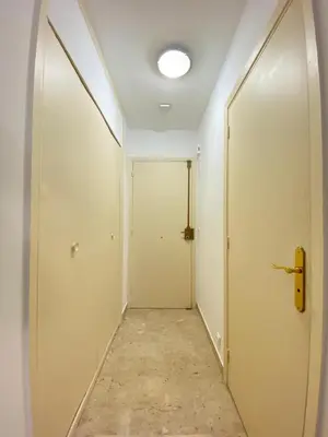 an empty corridor with a door and a phone at Emanuela in Nice