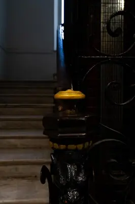 a black and yellow pole with stairs in a room at L'Écrin de la Piétonne in Nice