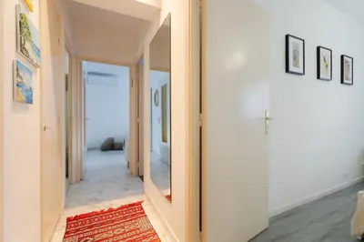 a hallway with a doorway leading into a room at Rue Michelet in Nice