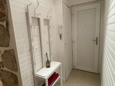 a white bathroom with a sink and a mirror at One-Bedroom Apartment near Promenade des Anglais in Nice