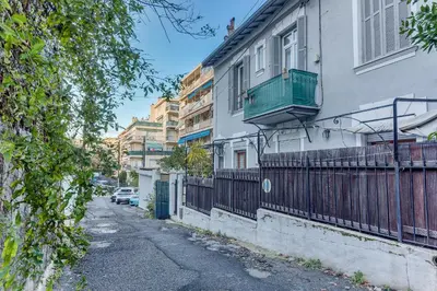 a building with a balcony on the side of a street at LE CYRNOS AP4499 By Riviera Holiday Homes in Nice
