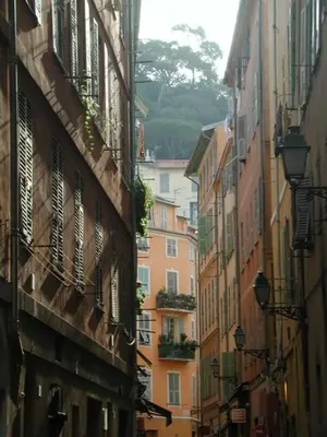 a view of an alley between two buildings at loft proche port Nice in Nice